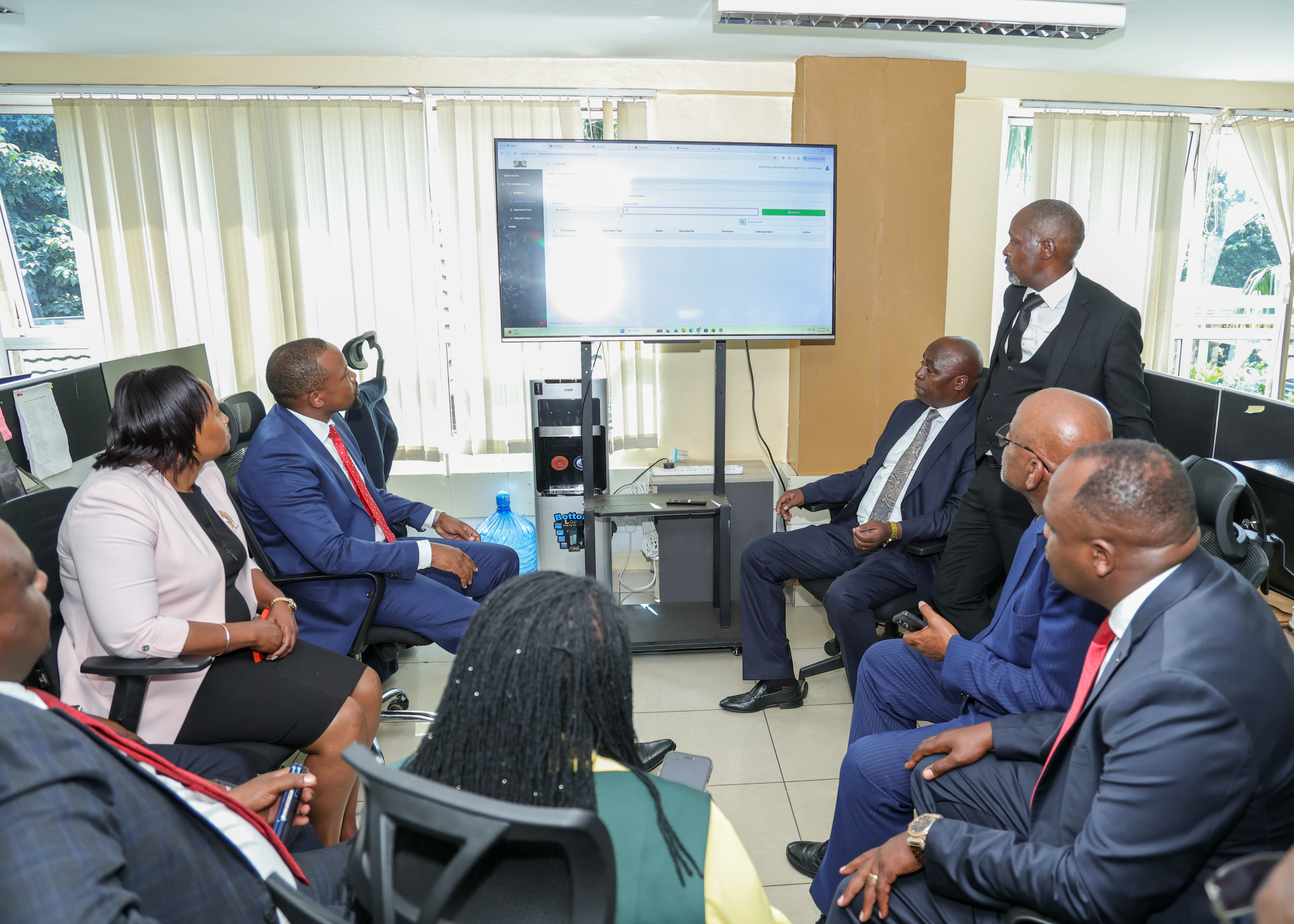 Members of Parliament are taken through the digitisation process at the Geospatial Data Centre