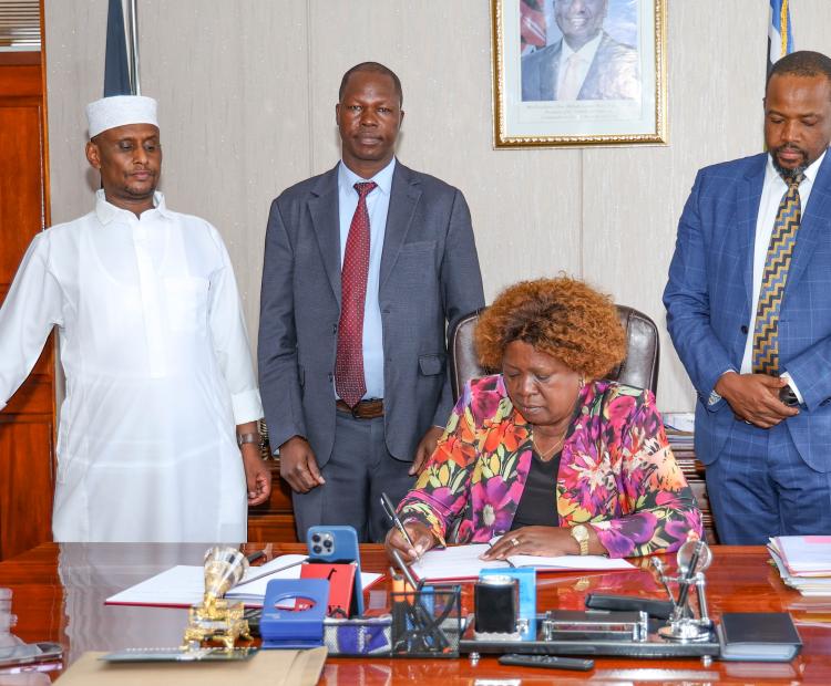 Lands CS Hon. Alice Wahome, flanked by PS National Government Coordination Ahmed Abdisalan Ibrahim, Lands PS Hon. Generali Nixon Korir, Public Works PS Joel Arumonyang during the signing of cascaded performance contracts and the mid-year assessment for the Financial Year 2025/2026. 