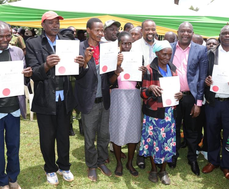 Lands Principal Secretary Hon. Generali Nixon Korir when he delivered title deeds for the resettlement of the squatters in Chelimo.